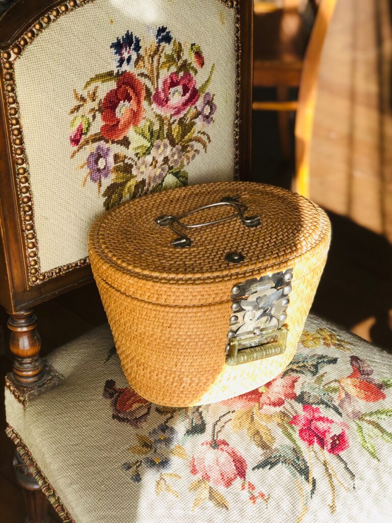 Wicker basket/box on an embroidered chair