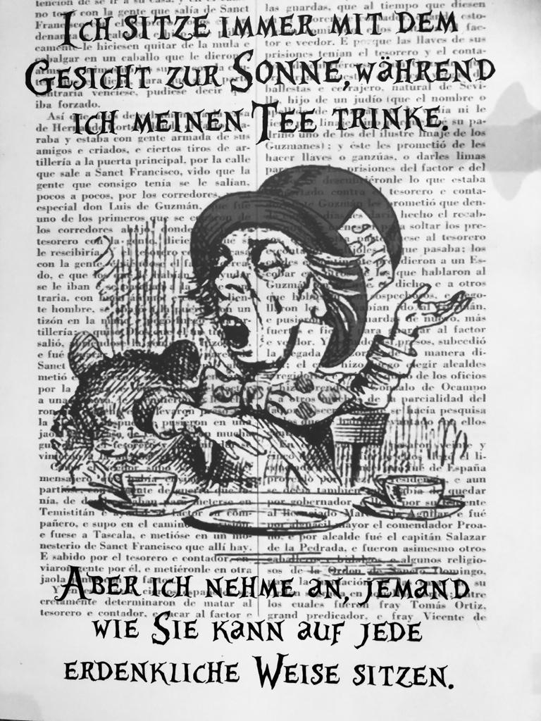Black and white photo of a mad hatter illustration on top of some text from a book